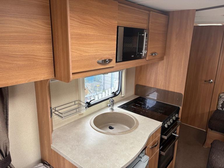 SPRITE MAJOR 4  - 4 BERTH CARAVAN, SIDE LOUNGE AREA ,END WASHROOM & MOTORMOVER