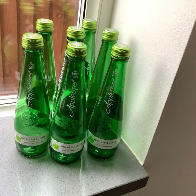 6 empty green glass bottles 