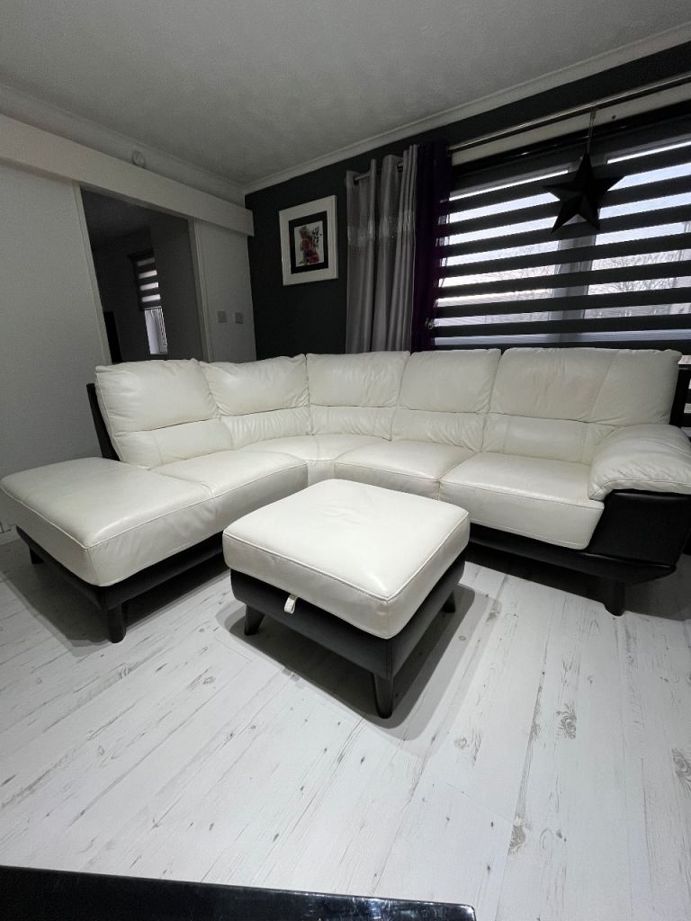 White leather sofa and footstool