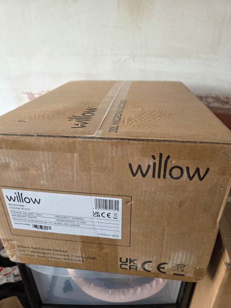 Brand new black microwave in box