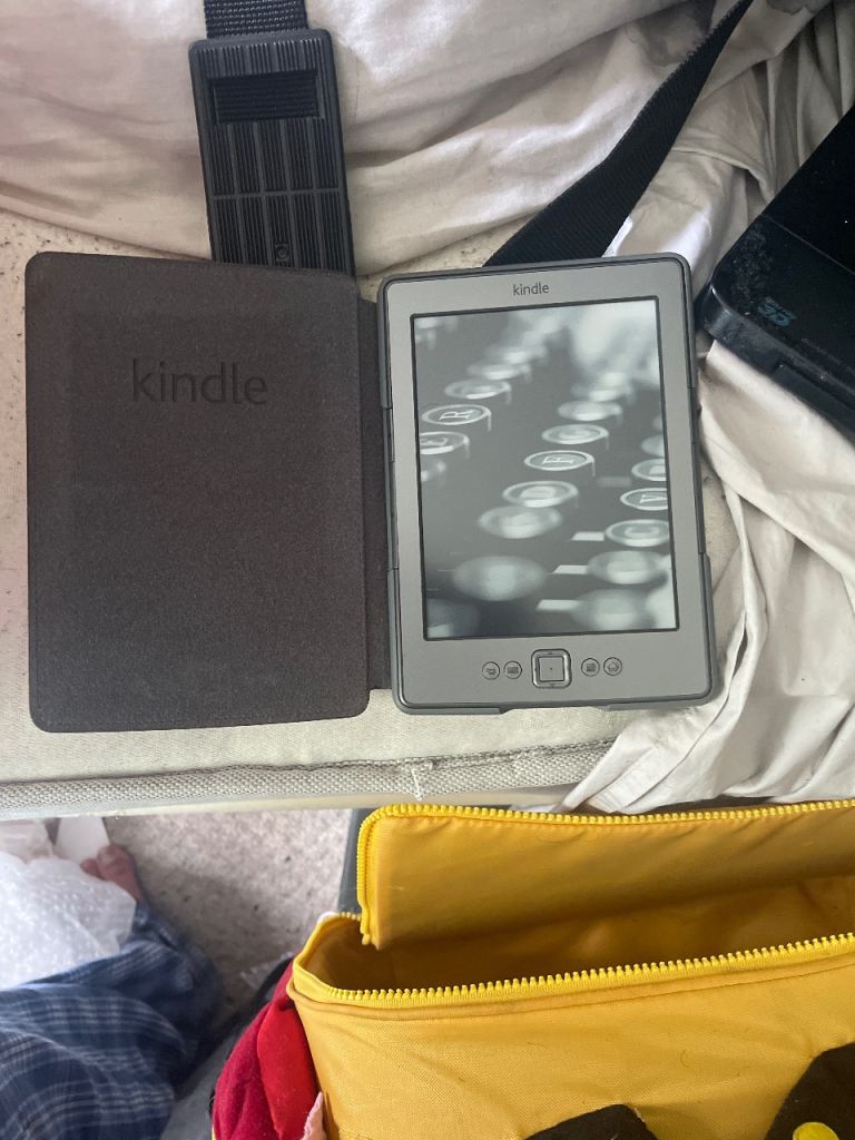 Kindle E-Reader with Brown Cover – Good Condition