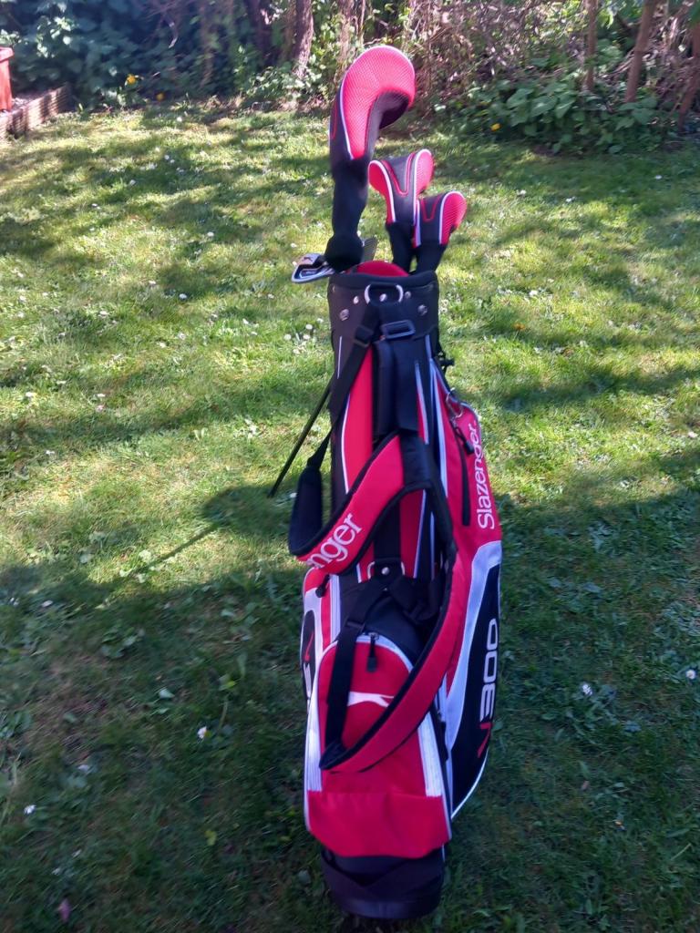 Golf clubs and trolly 