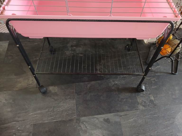 Lovely pink cage with stand on wheels 