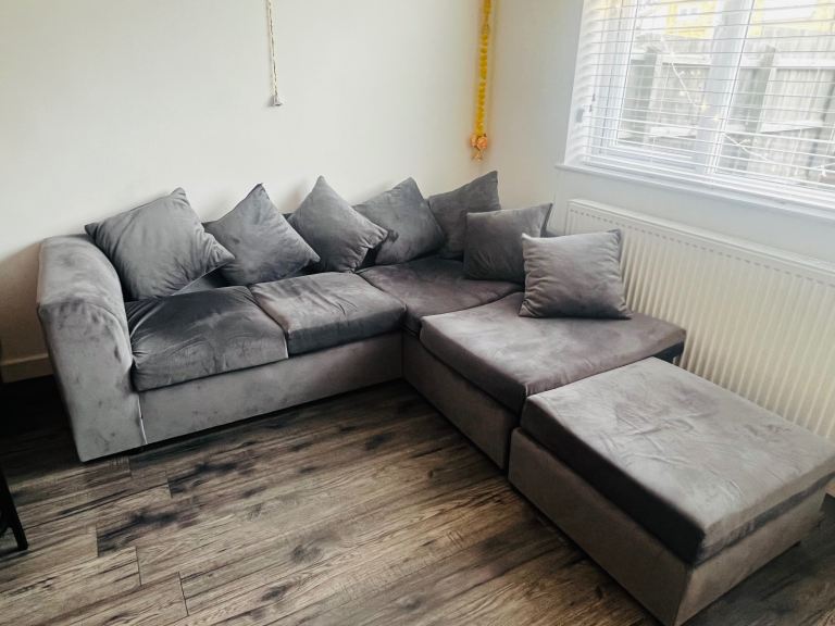 Grey corner sofa with foot stool and 6 cushions