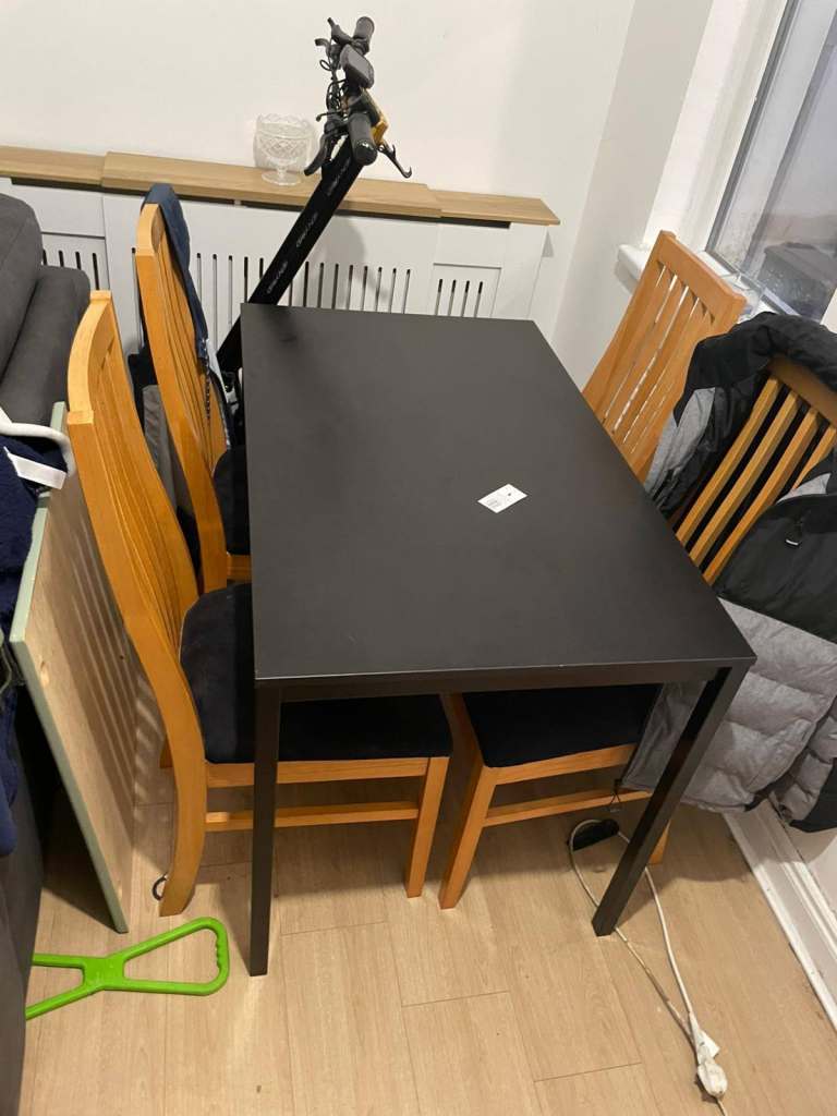 Black wood dining room table £40 chairs sold 
