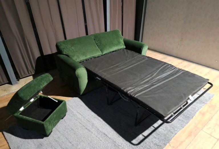 Green sofa bed grey and storage footstool.