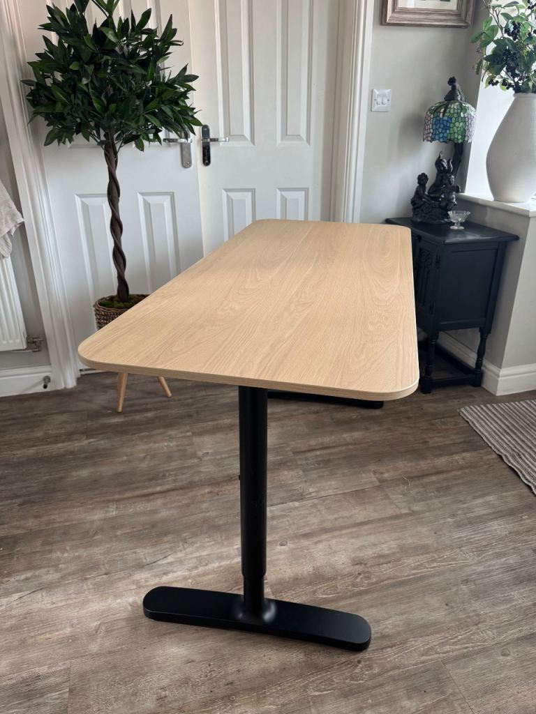 Desk table with adjustable legs for height preference 