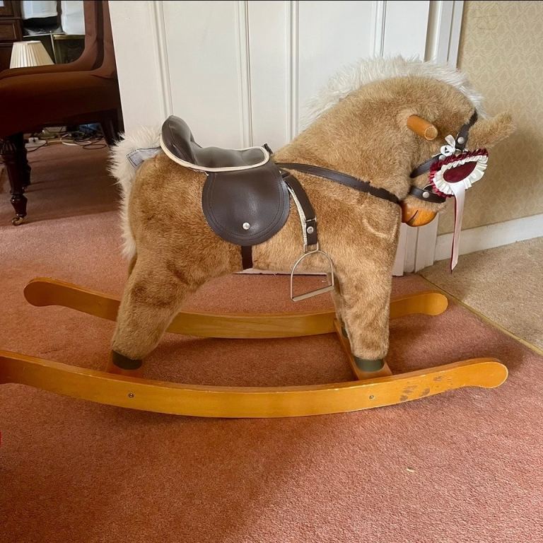Mamas & Papas plush rocking pony horse on a wooden base complete with stirups 