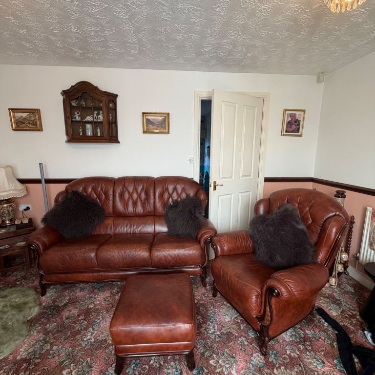 Three piece Italian leather suite - sofa armchair & foot stool. 