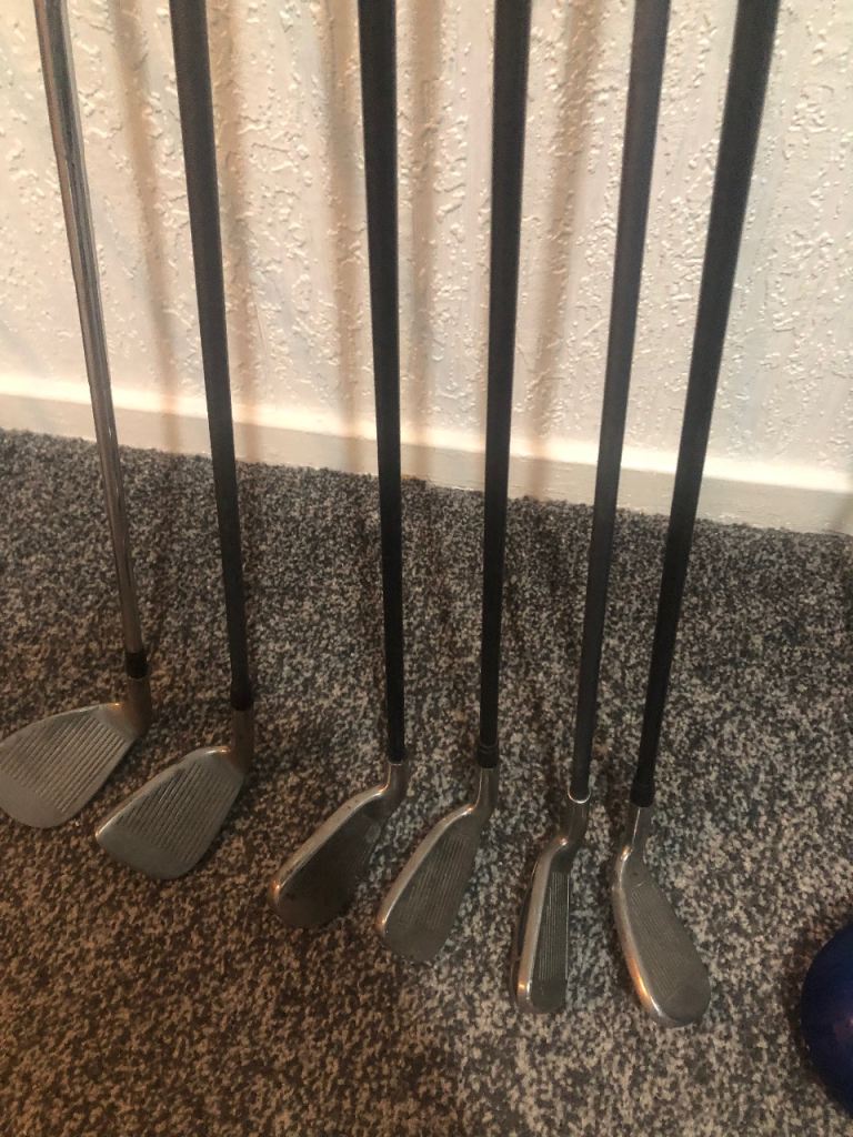 Job lot of golf clubs