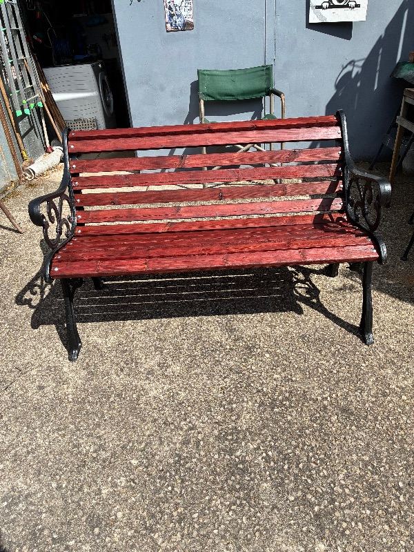 Garden Bench with Cast Iron Ends and Red Wood Slats