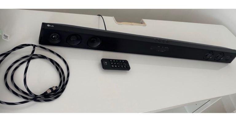 LG Soundbar with Remote and Cable – Good Condition