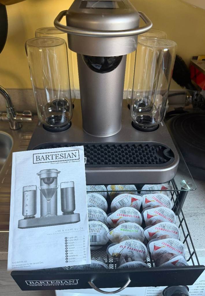 Cocktail maker BARTESIAN with stand and over 18 cocktail pods included.