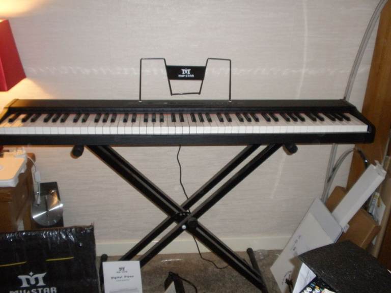 MuStar 88 Weighted keys electric piano with stand.