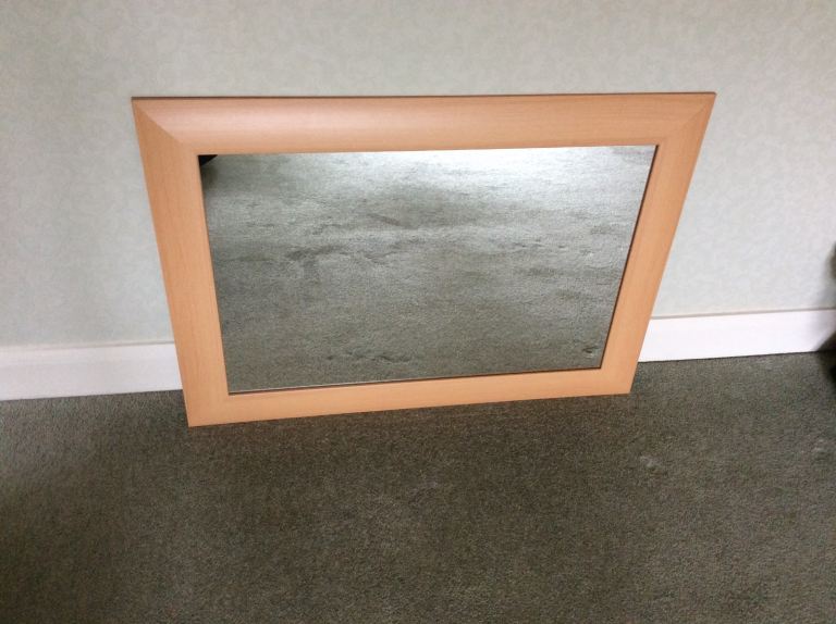 Beech effect mirror in excellent condition.