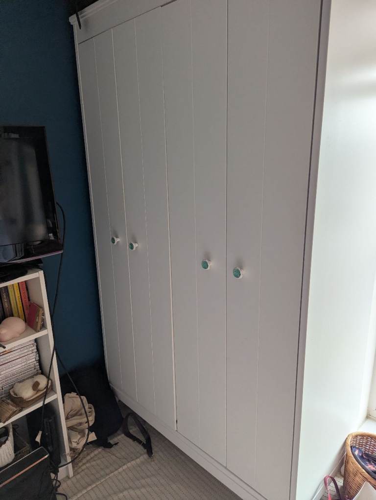 IKEA White bifolding Wardrobe with Patterned Knobs – Good Condition