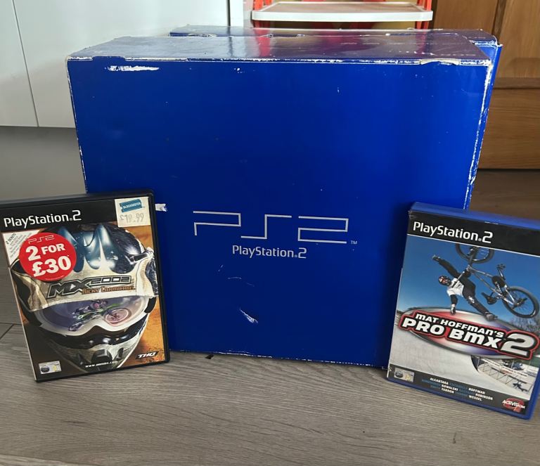 PlayStation 2 boxed with memory card & 2 games 