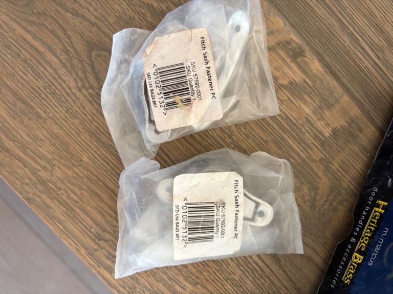 Shiny silver sash window locks