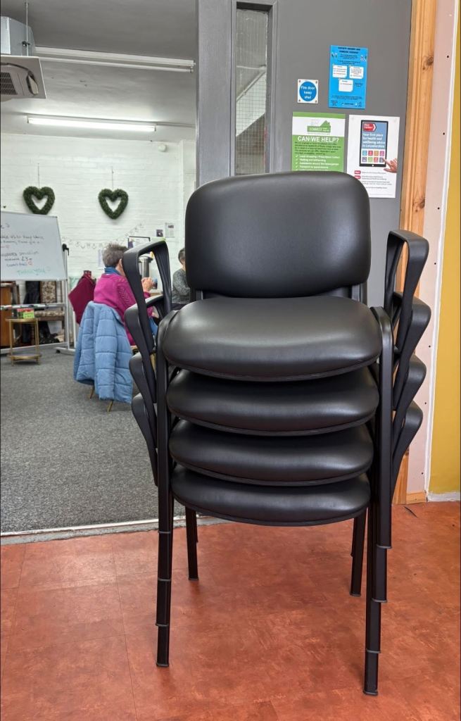 Stacking wipeable chairs with arms 