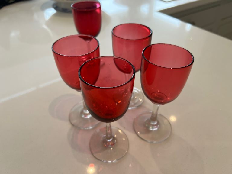 Set of 4 plus 1 antique cranberry glasses