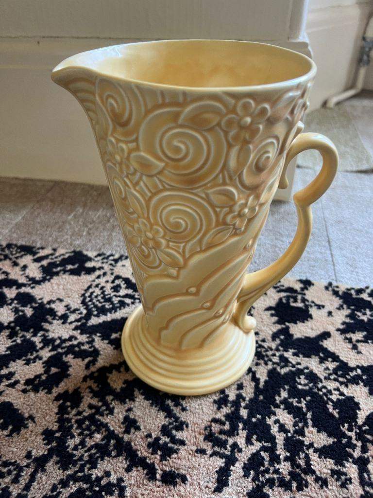 Yellow Wade Art Deco jug with a floral relief pattern