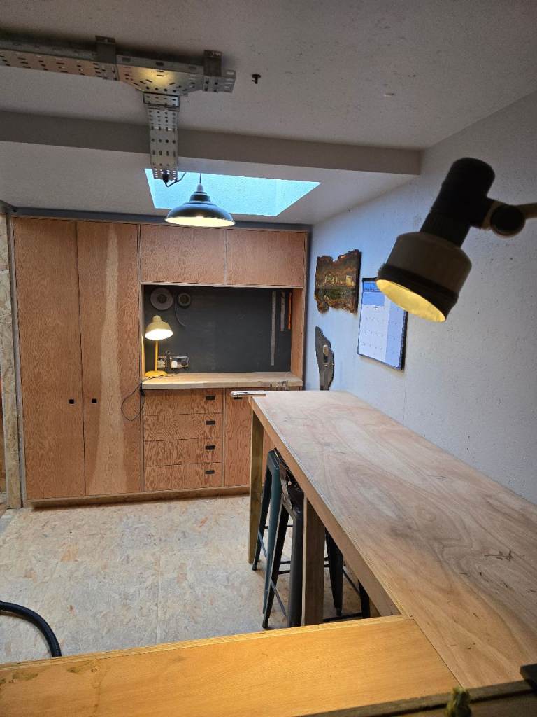 Small workshop space above woodworking shop.