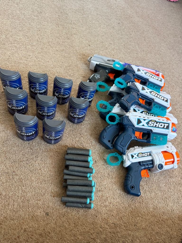 Nerf and shot guns with shot target and bullets 