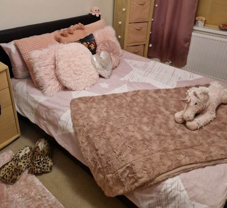 Black leather double bed frame with wooden slats