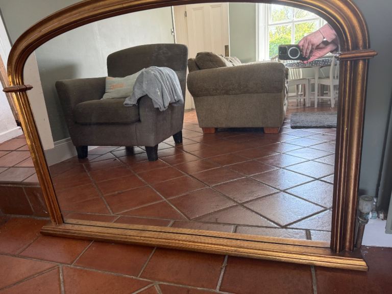 Large over mantle gold effect framed mirror