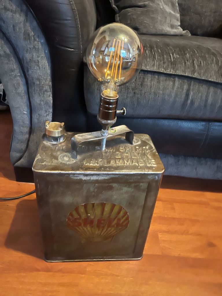  vintage Shell fuel can that has been repurposed into a table lamp