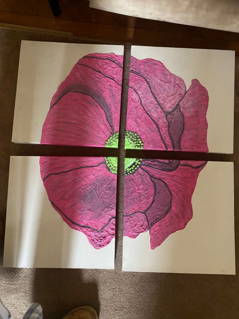 4 canvasses creating picture of pink flower
