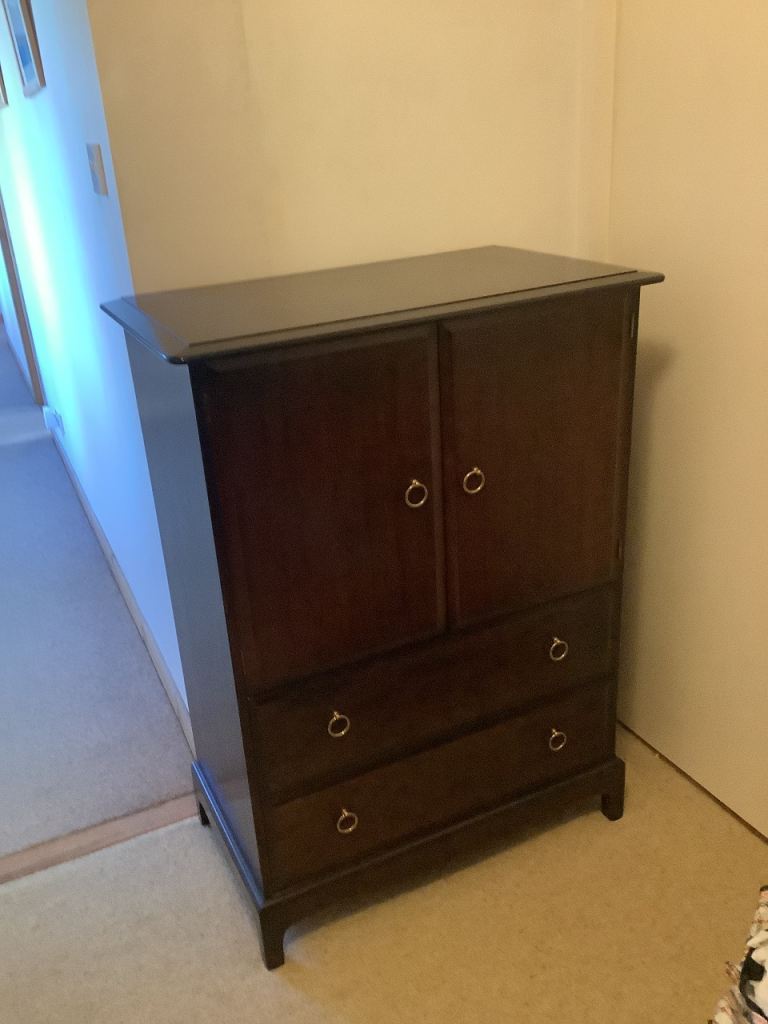 Stag Minstrel dark wood, two door cupboard and two drawer linen cupboard
