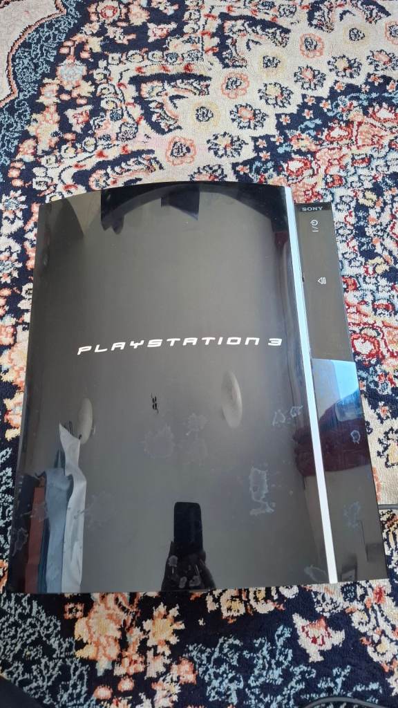 Sony PS3 with 1 extra controller and games