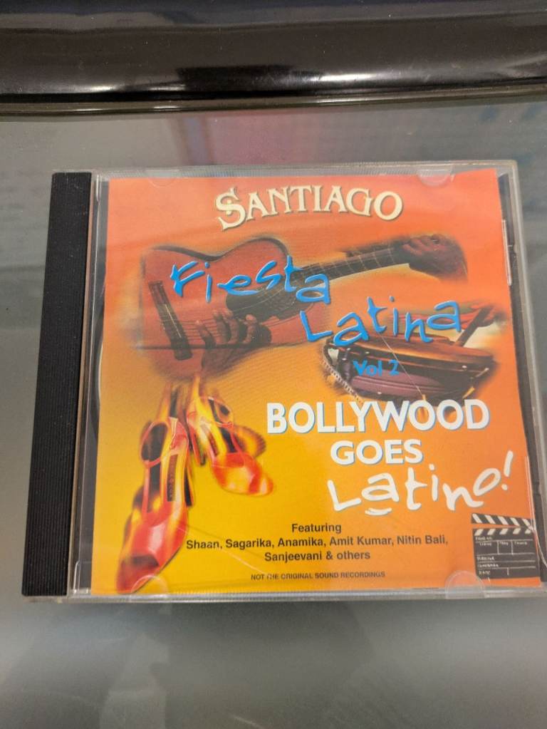 Santiago Bollywood goes latino Indian Asian Hindi Bollywood Blockbuster Music CD ref 32