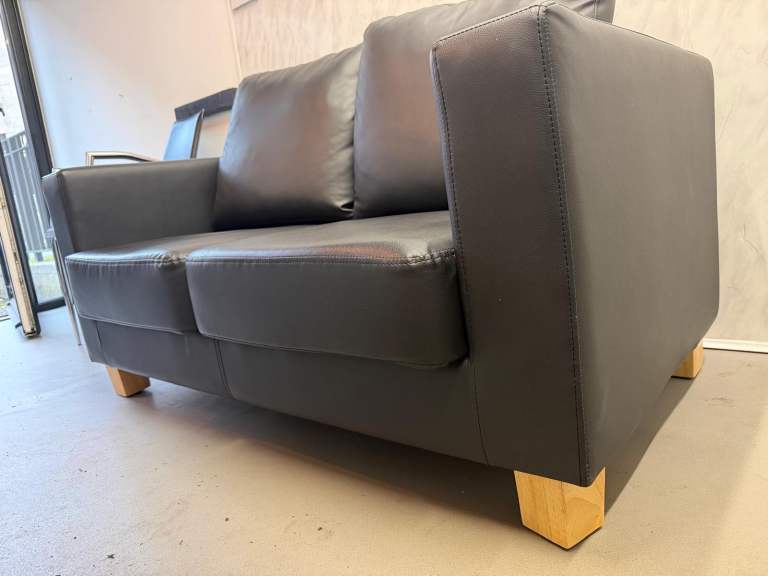 Black Leather Two-Seater Sofa –Excellent Condition 