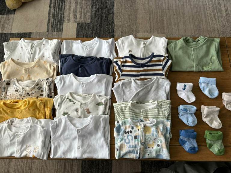 Bundle of first size baby grows