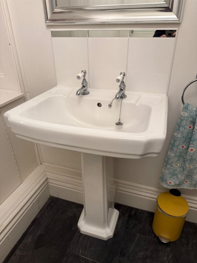 Bathroom sink and taps