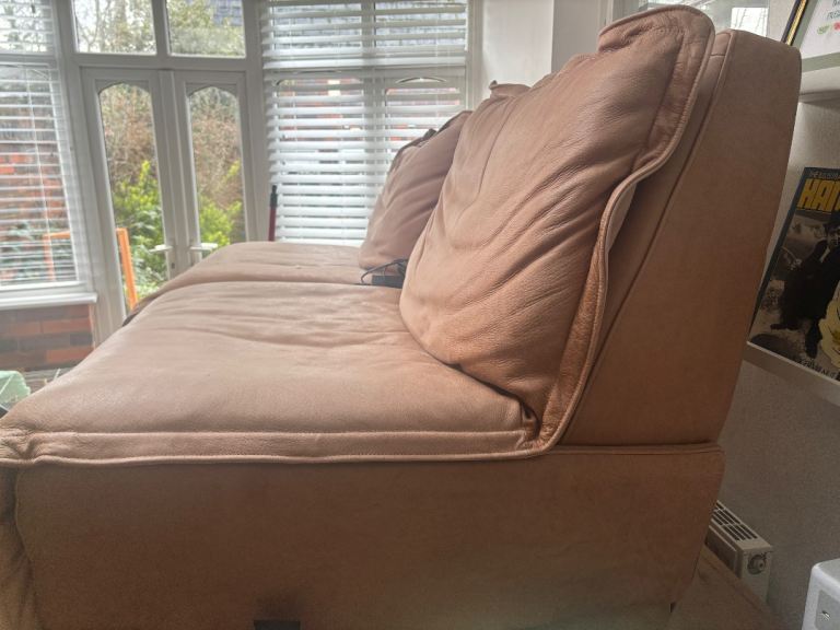 Two reclining arm chairs 
