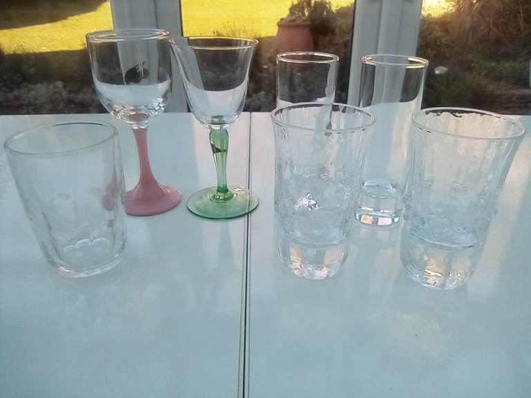 New, unused shot and liqueur drinking glasses, two with playing card emblems on.