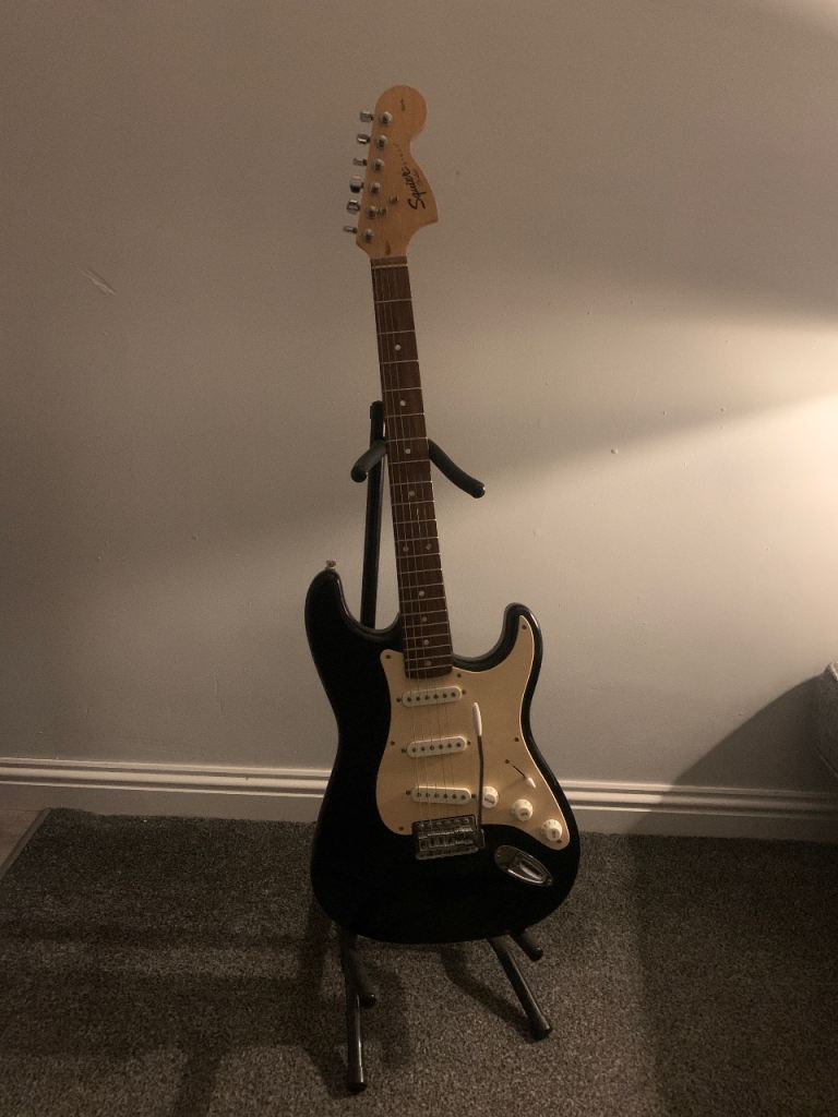 Fender Squier Strat, with stand and guitar bag