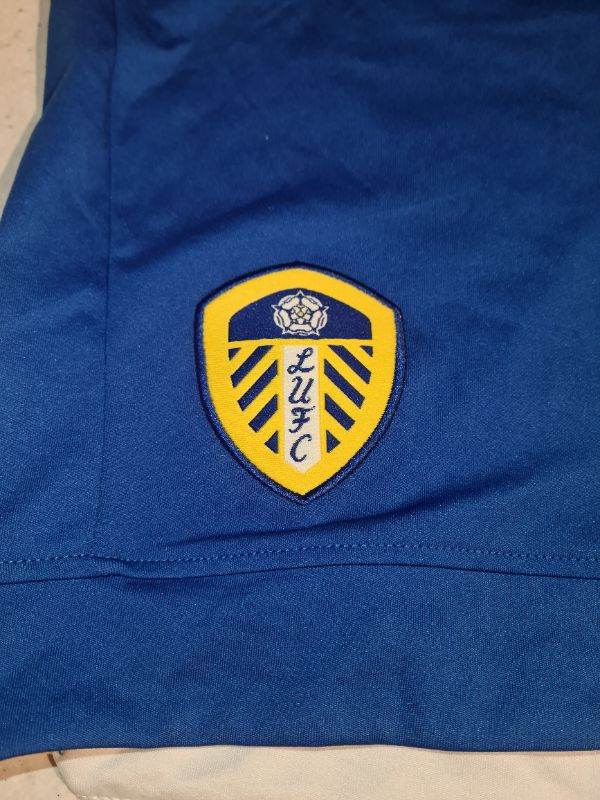 Leeds United Macron football shorts in great condition. Says UK medium but more like mens l/ xl