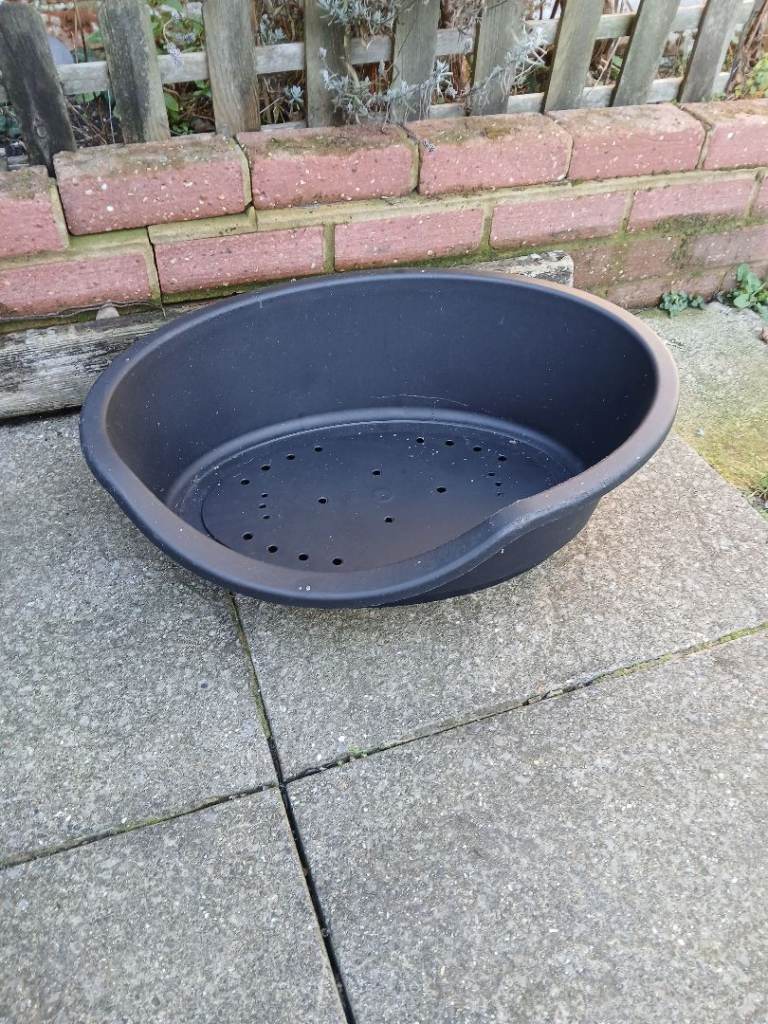 Black plastic dog bed