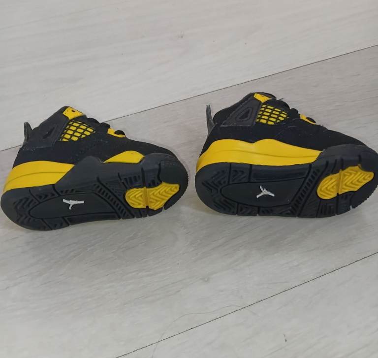 Baby Jordan 4 black and yellow trainers size 2.5