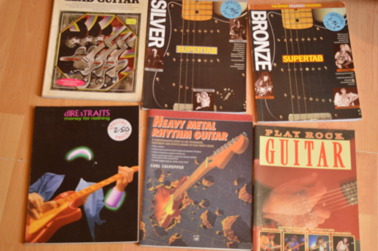 Collection of guitar chord and tab books
