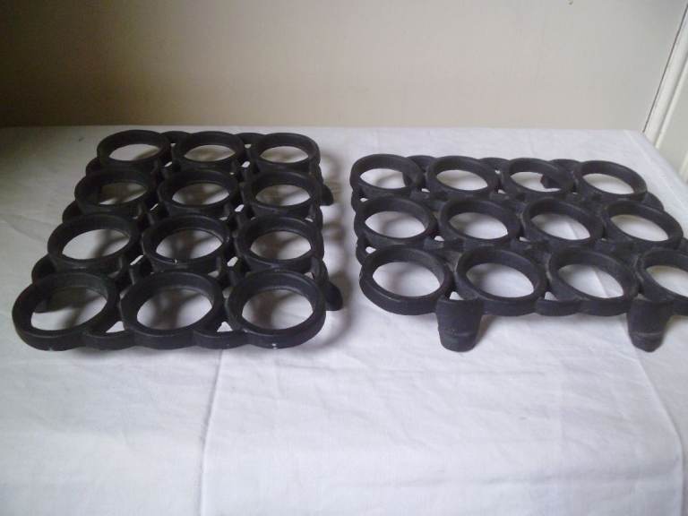 PAIR OF BLACK CAST IRON TRIVETS