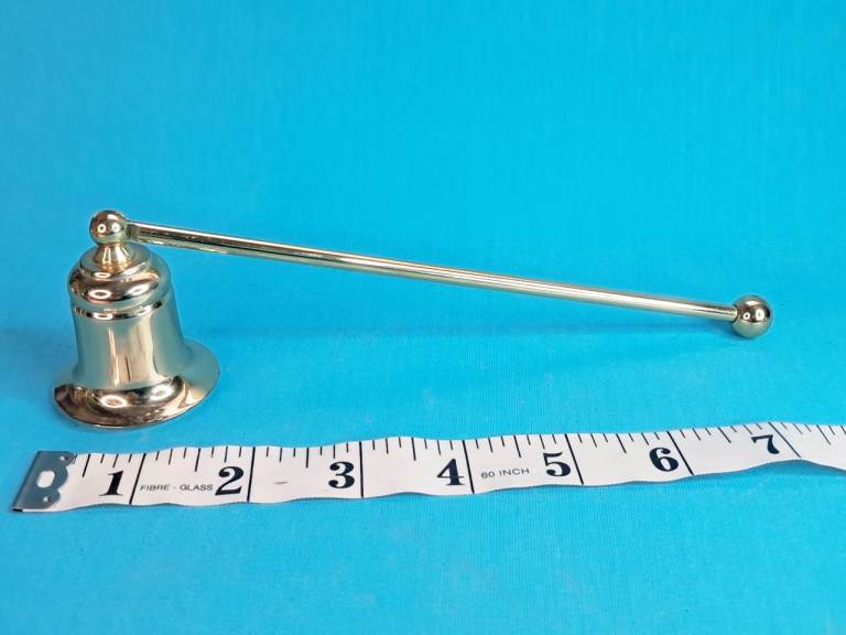 vintage polished brass candle snuffer.