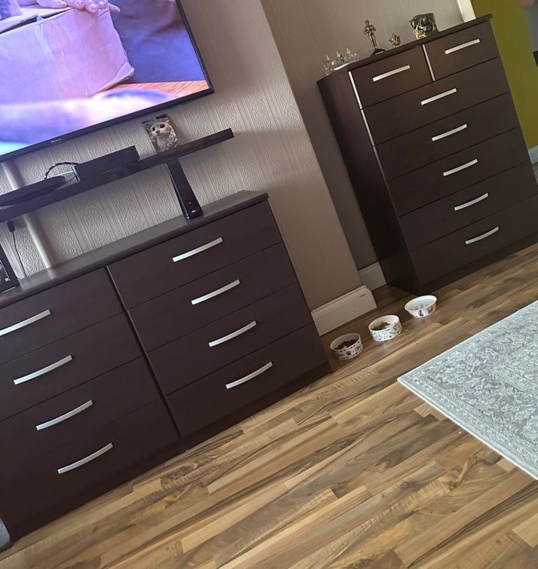 2 matching dark wooden drawer sets with silver hardware 