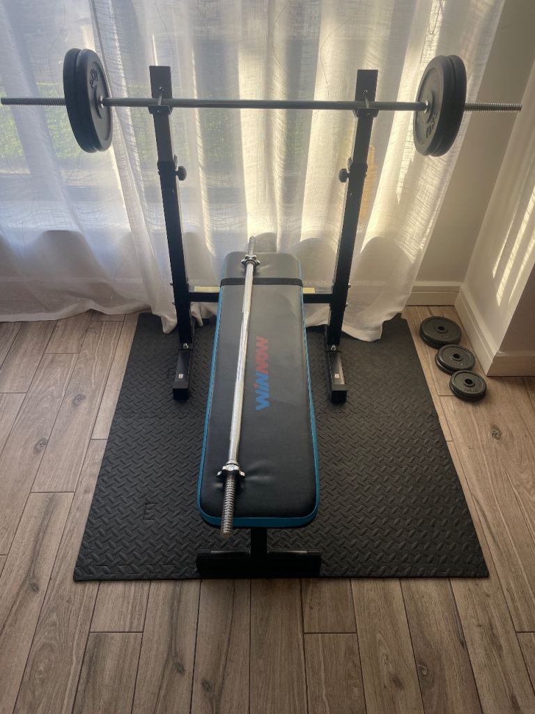 Bench with barbell and weights