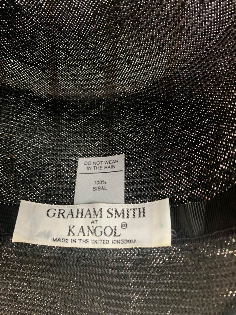 Graham Smith floral fascinator with a wide brim.