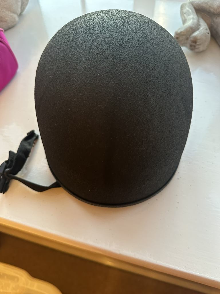 Three horse riding hats